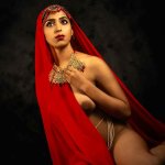 Desi model showing her boobs and posing almost nude in a braless saree