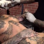 Amber Luke masturbates while getting tattooed