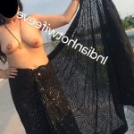 Sensational Topless Desi MILF shows her boobs by opening her braless black saree in an open road