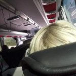 The naked blonde masturbates in a public bus.
