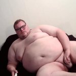 fat man watching porn and masturbating his small cock
