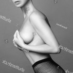 Young Naked Woman Fishnet Tights Stockfoto 1173122071