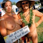 As Nudestock is a naked music festival individuals use flamboyant accessories to decorate their bodies Stock Photo