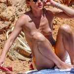 Emma Watson captured topless on a beach in Ibiza in Voici Magazine