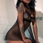 Ebony babe Barbie is fucking herself with a fuck machine