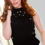 Redhead pornstar Ella Hughes gets naked to show her sexy natural curves